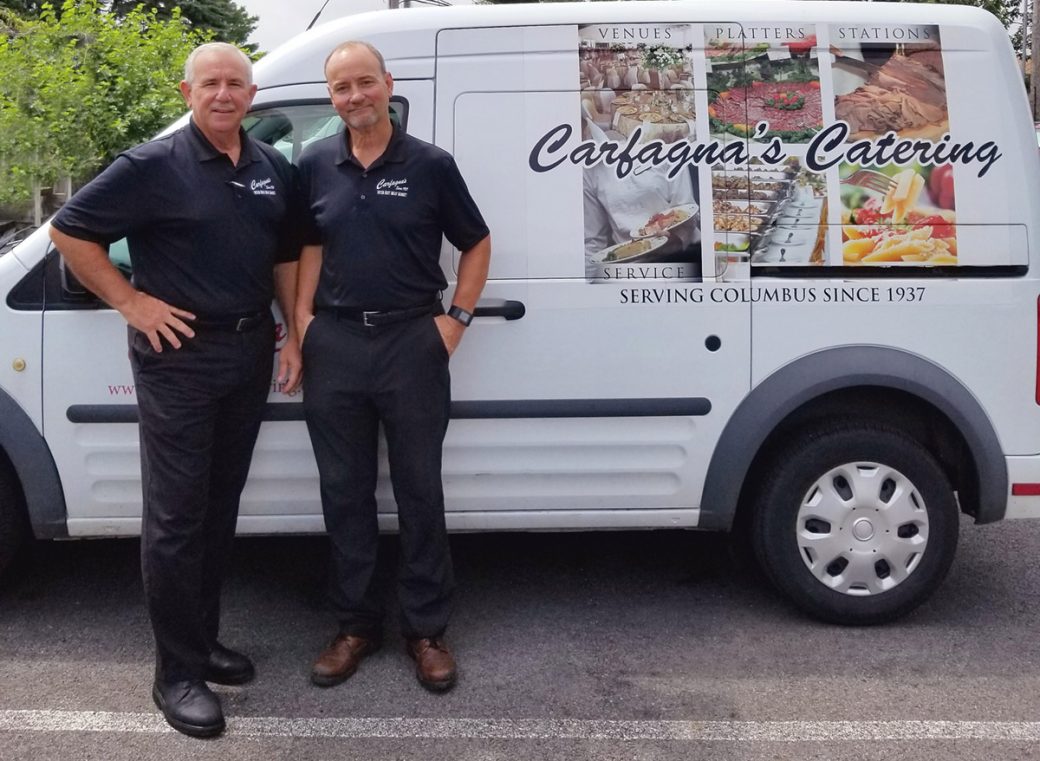 Photo of Dino & Sam Carfagna with one of their catering trucks.